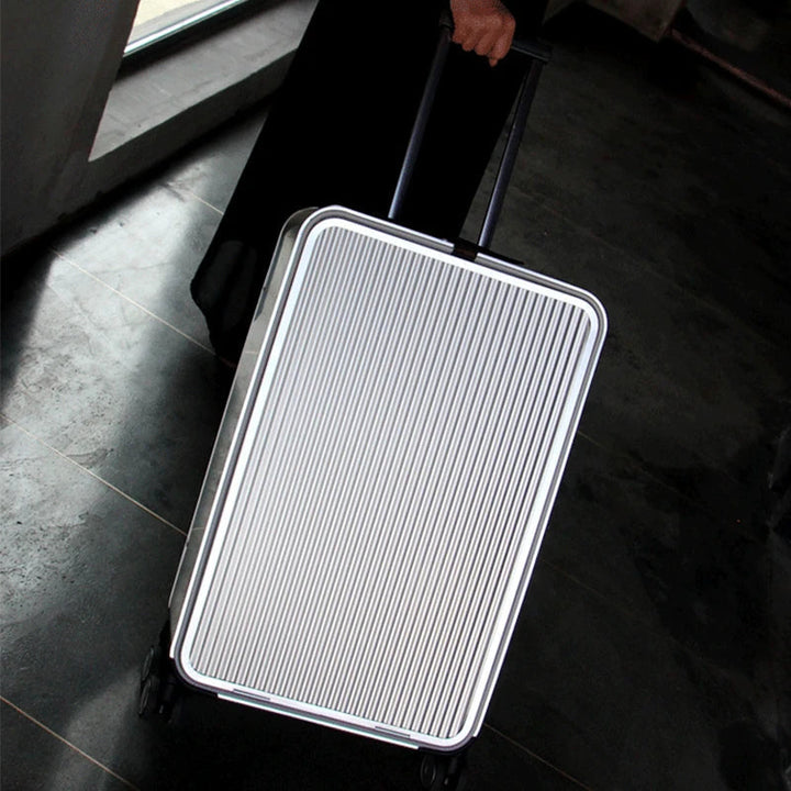 Unisex aluminum spinner luggage, hardshell, with smooth rolling wheels for easy travel.