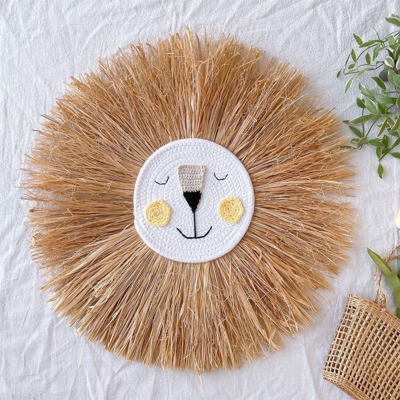 Rattan lion animal wall decor, handmade bohemian nursery art for a baby's or kids' room.