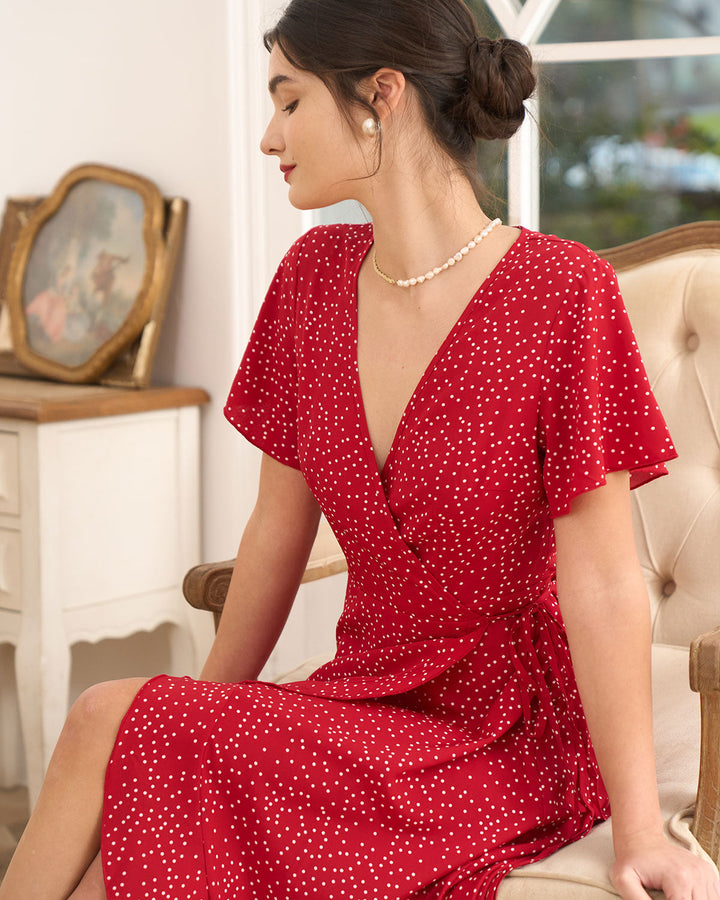 Elegant women's short sleeve wrap midi dress with red polka dots, ideal for special occasion guests.