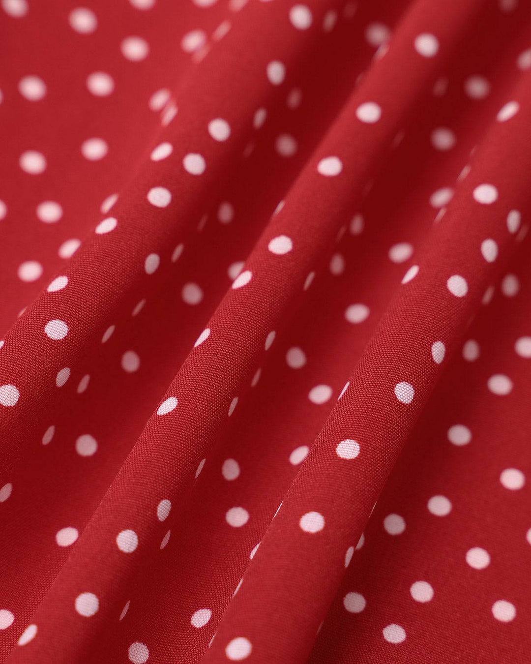 Women's wrap style midi dress in red polka dot print, perfect elegant party or wedding guest outfit.