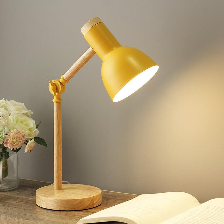 Scandinavian wooden desk lamp with foldable design, colorful shade, adjustable height, and sturdy base. Ideal for any decor.