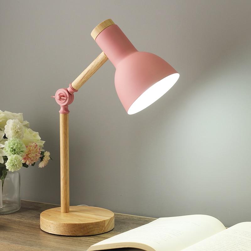 Scandinavian wooden desk lamp with foldable design, colorful shade, adjustable height, and sturdy base. Ideal for any decor.