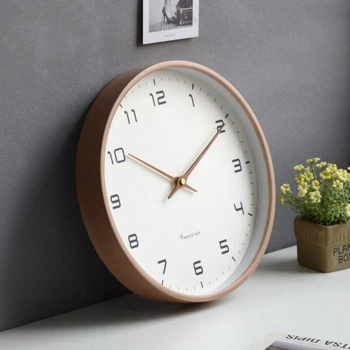 Modern silent wall clock, Scandinavian style, for chic home & office decor. Features a minimalist brown & cream design.