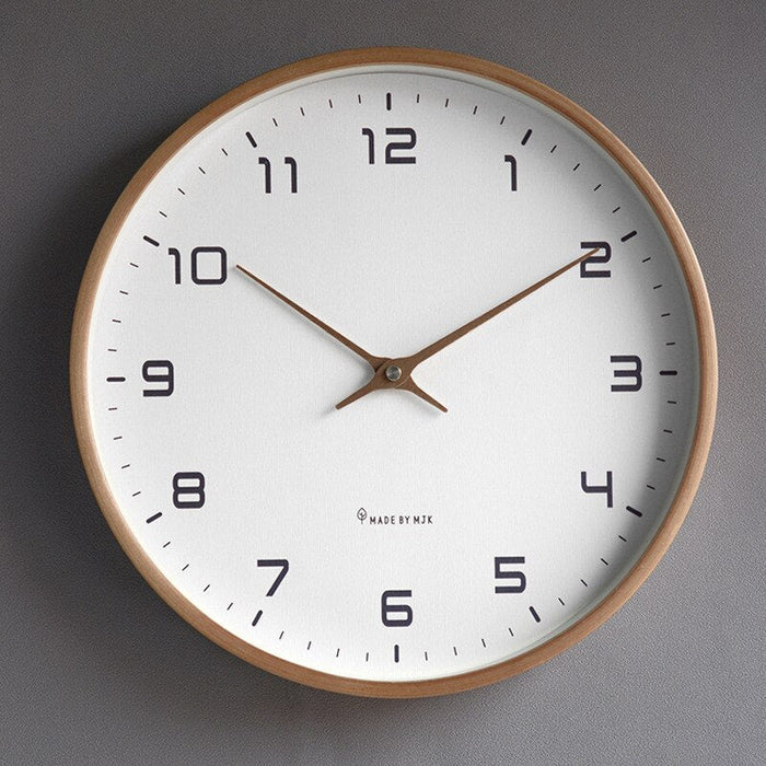 Close-up of a silent Scandinavian wall clock, highlighting its minimalist modern design & brown/cream finish.