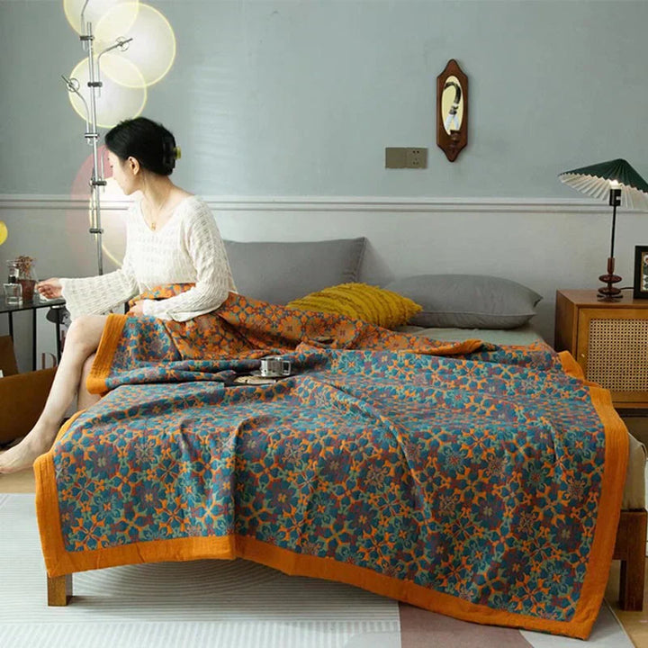 Six-layer orange & blue pattern cotton quilt for cozy bedroom decor.