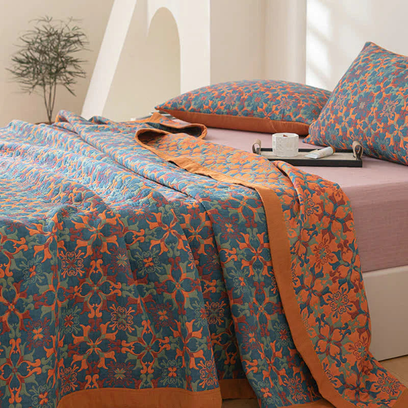 Eco-friendly six-layer cotton quilt in an orange & blue pattern, perfect for cozy bedroom decor.