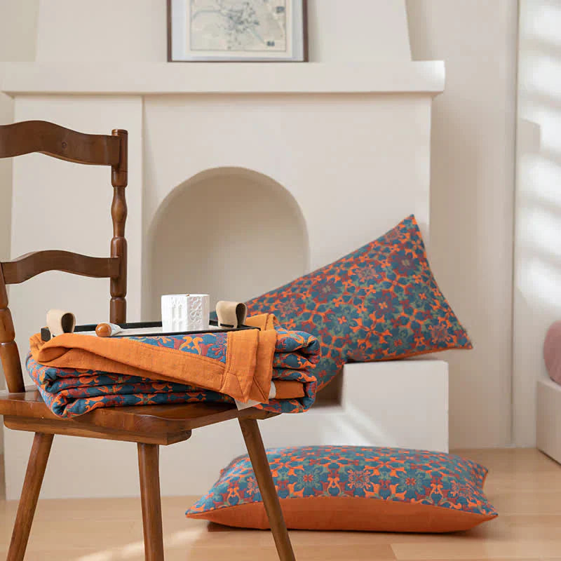 TerraLoom six-layer cotton quilt, featuring a stylish orange & blue pattern for cozy bedroom bedding.
