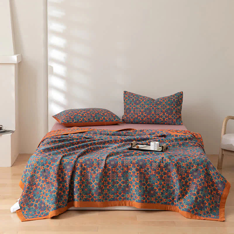 Stylish orange & blue patterned six-layer cotton quilt, a cozy duvet alternative for bedroom decor.