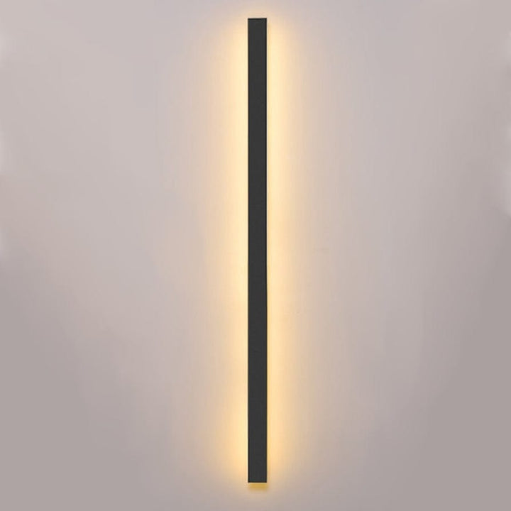 Sleek aluminium outdoor wall sconce with backlit design, ideal for modern patios; corrosion-resistant and stylish.
