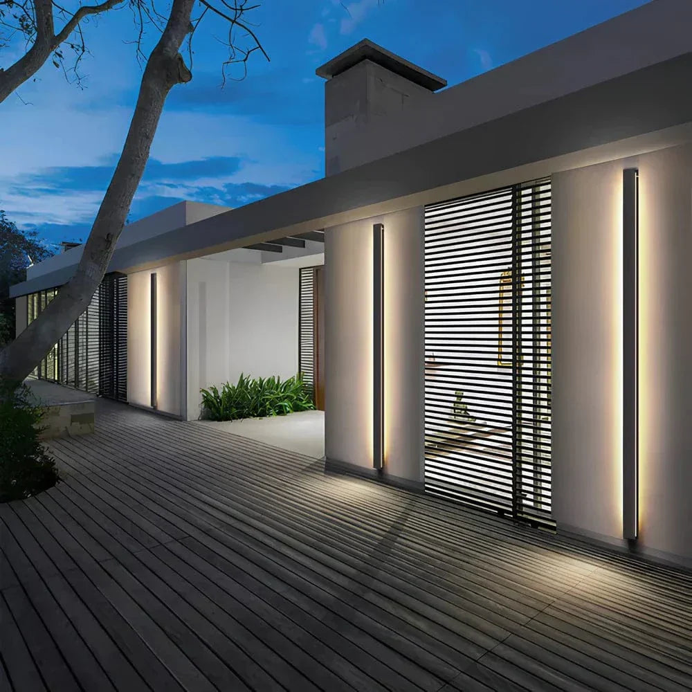 Sleek aluminium outdoor wall sconce with backlit design, ideal for modern patios; corrosion-resistant and stylish.