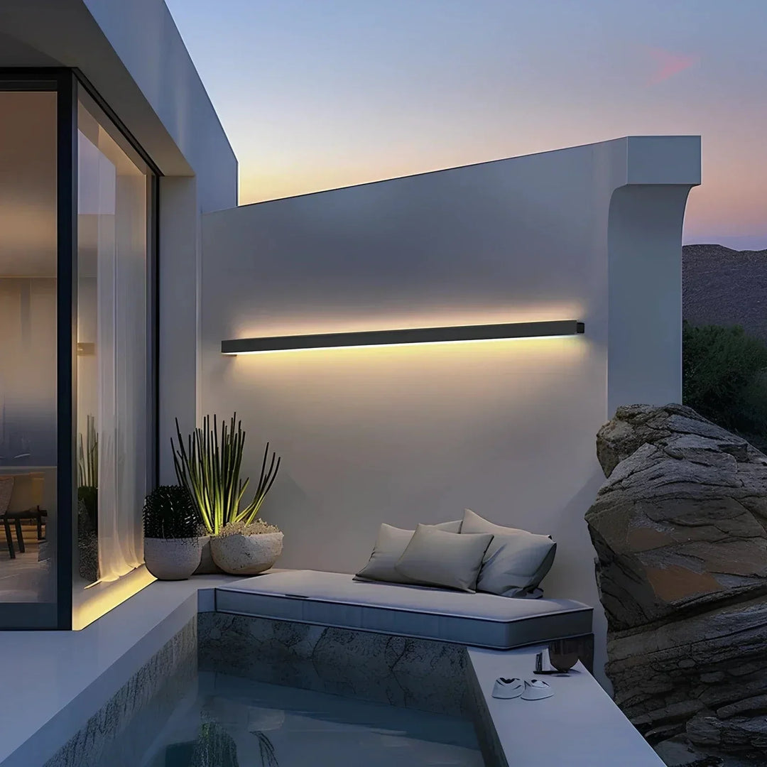 Sleek aluminium outdoor wall sconce with backlit design, ideal for modern patios; corrosion-resistant and stylish.
