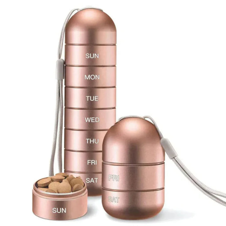 Compact aluminum weekly pill holder for managing daily medication dosages and supplements, ideal for travel.