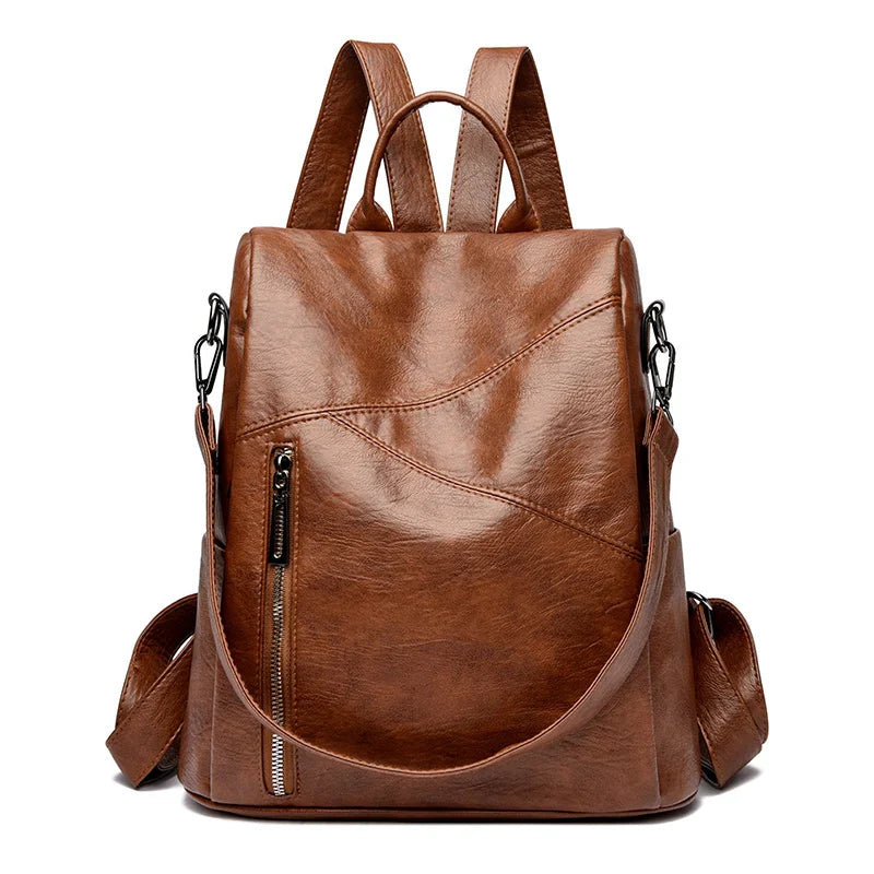 Women's black leather backpack, featuring a sleek urban design & ample storage.
