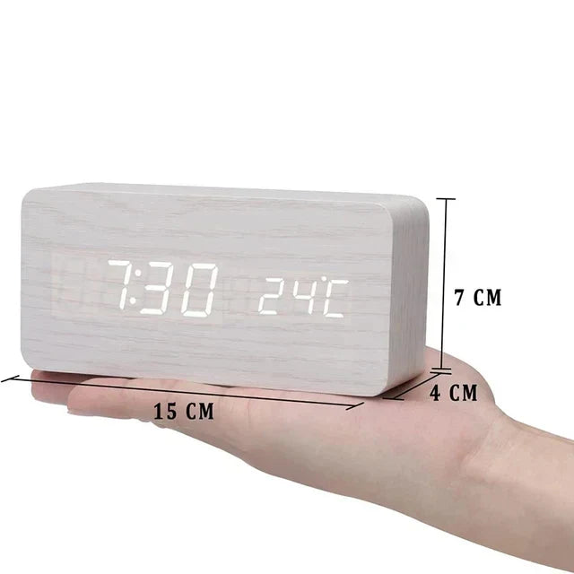 Minimalist digital alarm clock for home office, LED display, voice control functionality.