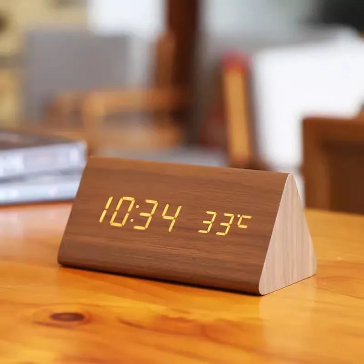 Minimalist smart clock with bright LED display and temperature reading for modern decor.