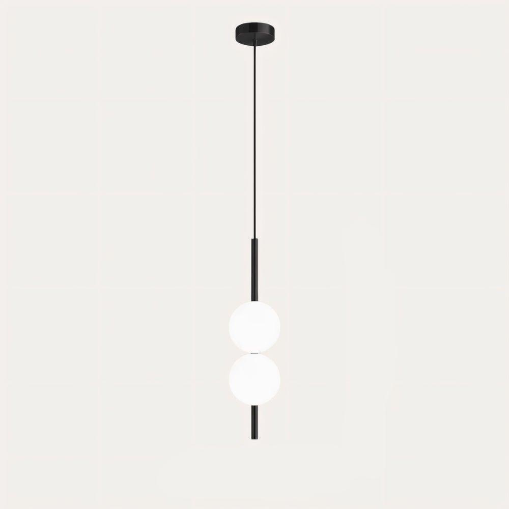 "Sleek glass ball Nordic pendant light with metal frame, LED bulb; available in black or brass, perfect for modern decor."