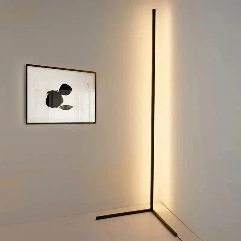 "Sleek RGB corner lamp with remote, minimalist design, vibrant colors, chrome finish, ideal for modern interiors."