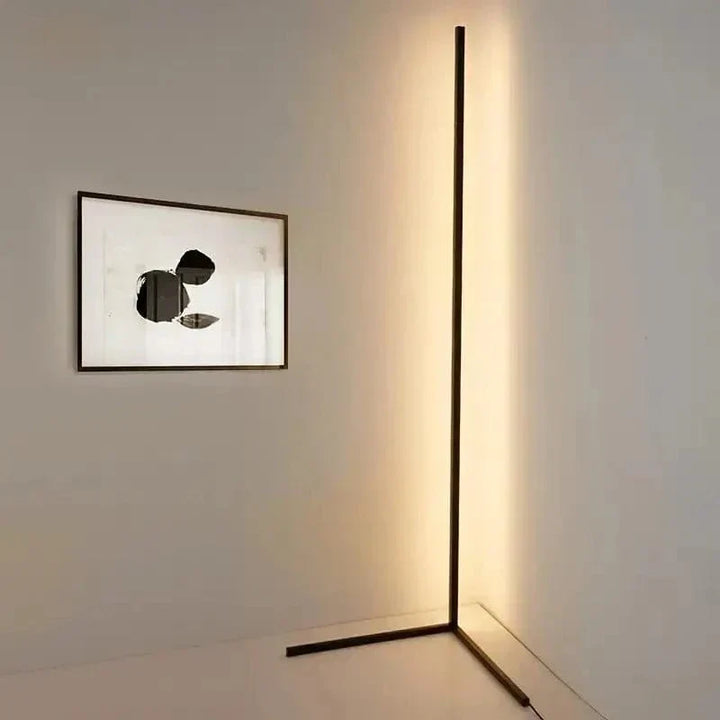 "Sleek RGB corner lamp with remote, minimalist design, vibrant colors, chrome finish, ideal for modern interiors."