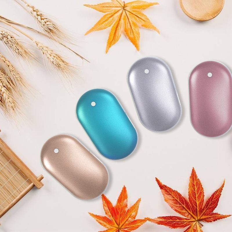 "Sleek silver portable USB hand warmer and powerbank, compact size, double-sided heating, ideal for chilly outdoor use."