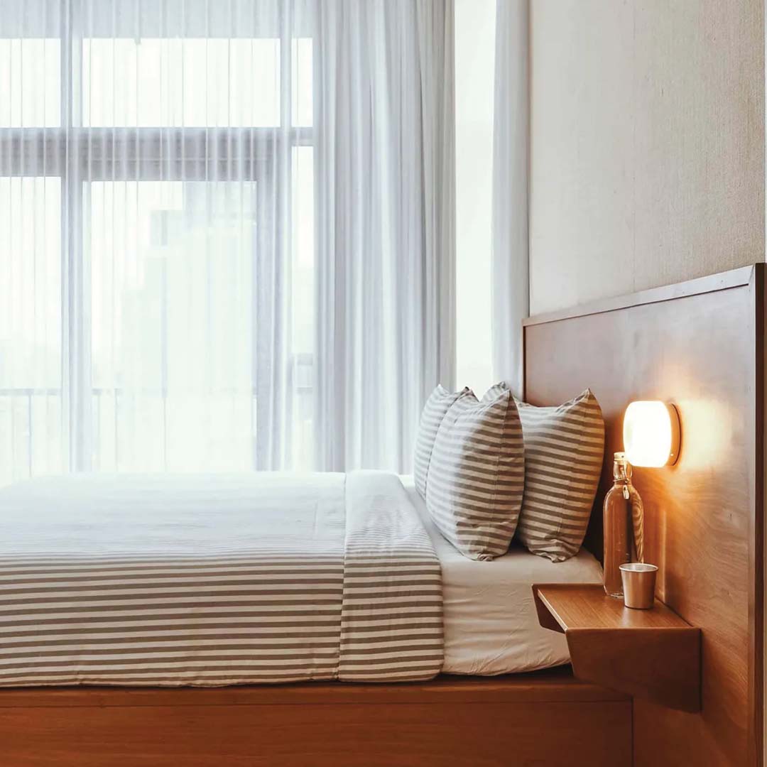 "Sleek wall mounted LED sconce light with acrylic and aluminum design, offering versatile decor enhancement for modern interi