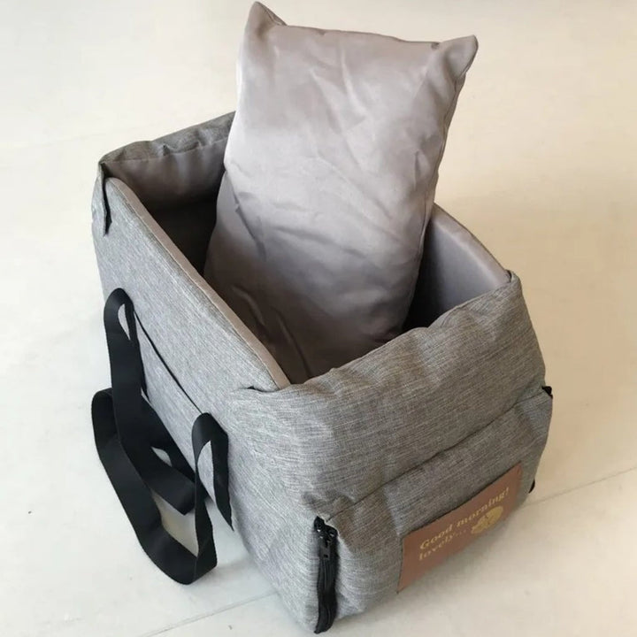 "Small Dog Cosy Car Seat Carrier Basket with padded interior, sleek design, fits securely in car for safe pet travel."