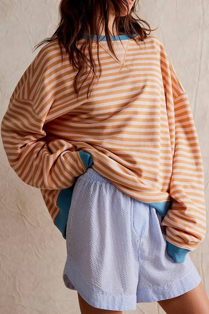 "Soft women's striped crewneck sweater, high-quality material, timeless design, versatile fashion for casual wear."