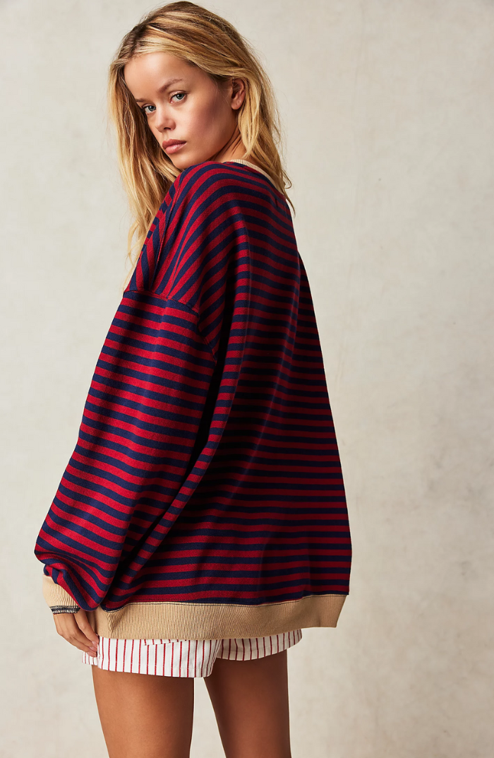 "Soft women's striped crewneck sweater, high-quality material, timeless design, versatile fashion for casual wear."