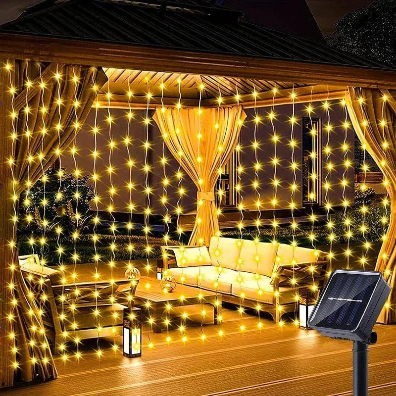 "Solar LED curtain light with copper wire, ideal for events, featuring warm white LEDs and solar power, outdoor use."