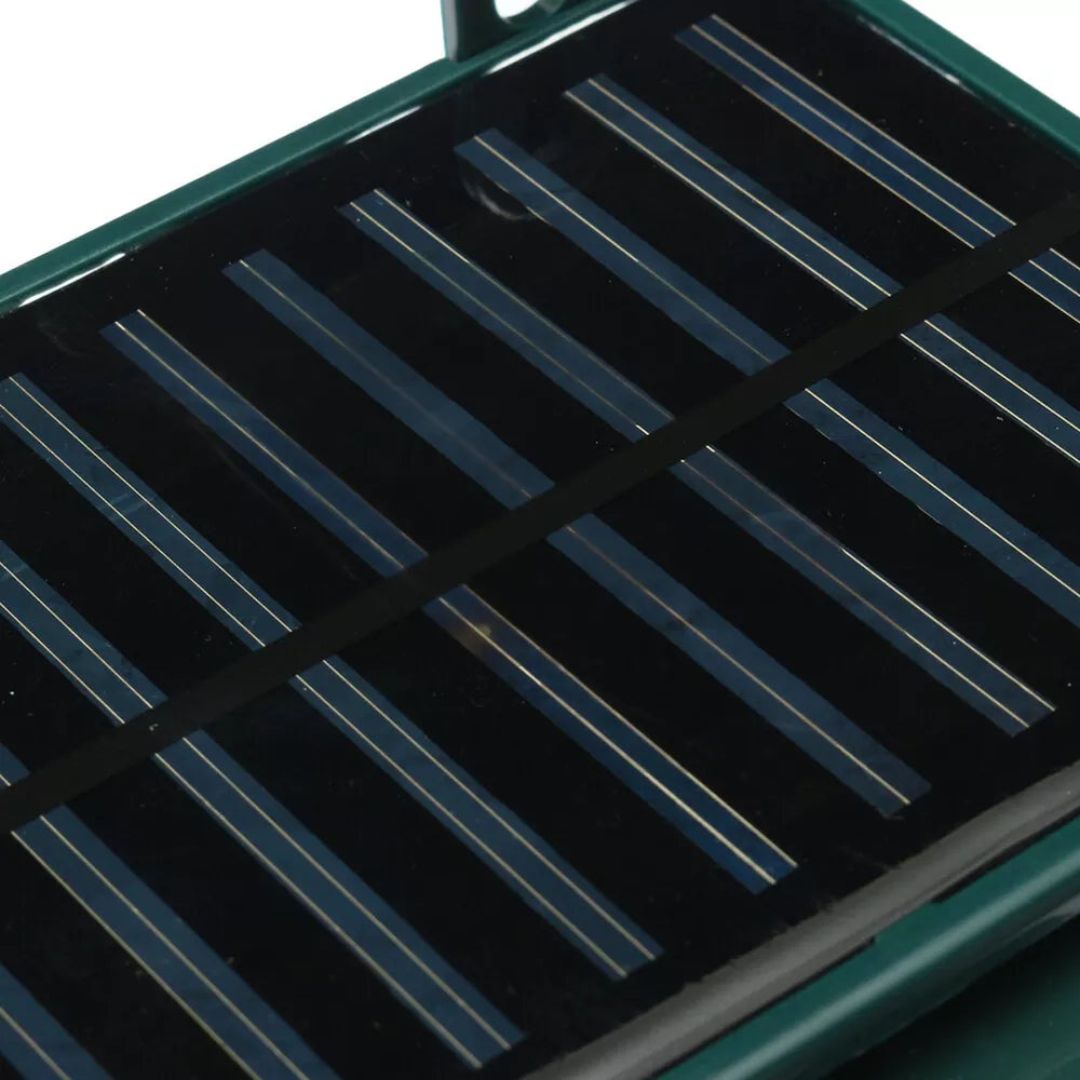 "Solar-powered motion sensor bird repeller, green and gray, for eco-friendly outdoor pest control in gardens and patios."