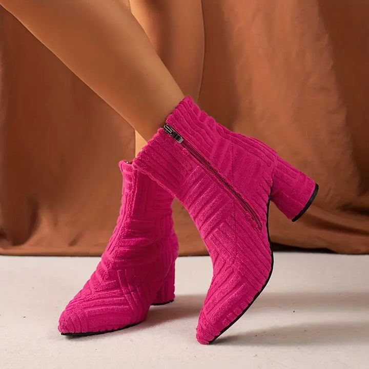 Stylish solid-colored women's ankle boots featuring a pointed toe, sturdy block heel, & platform sole. Selene fashion boots.