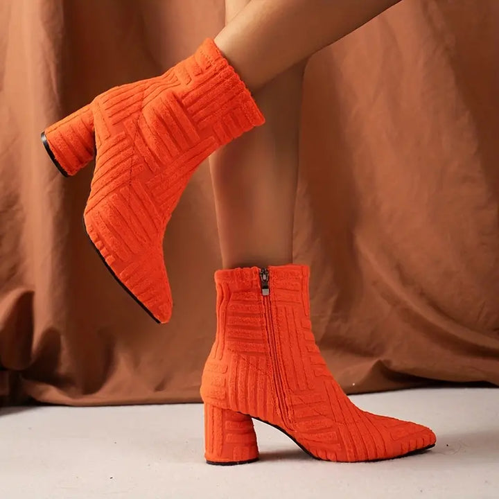 Modern solid Selene women's zipper ankle boots, featuring a sharp pointed toe & fashionable block heel.