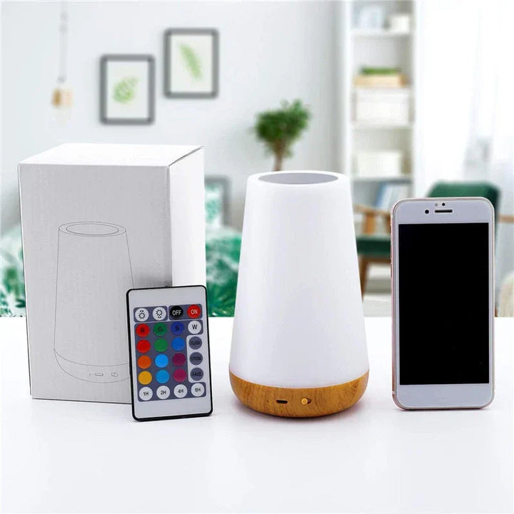 Rechargeable LED night light with intuitive touch control, offering ambient lighting for a relaxing bedroom atmosphere.