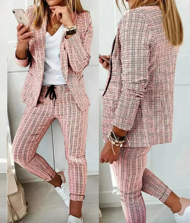 Sophisticated women's two-piece business suit, professional blazer & pants set for elegant office wear.