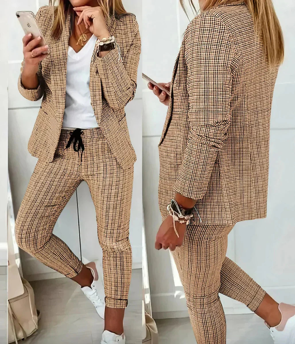 Chic pink women's business suit, a stylish two-piece blazer & trousers set for modern professional attire.