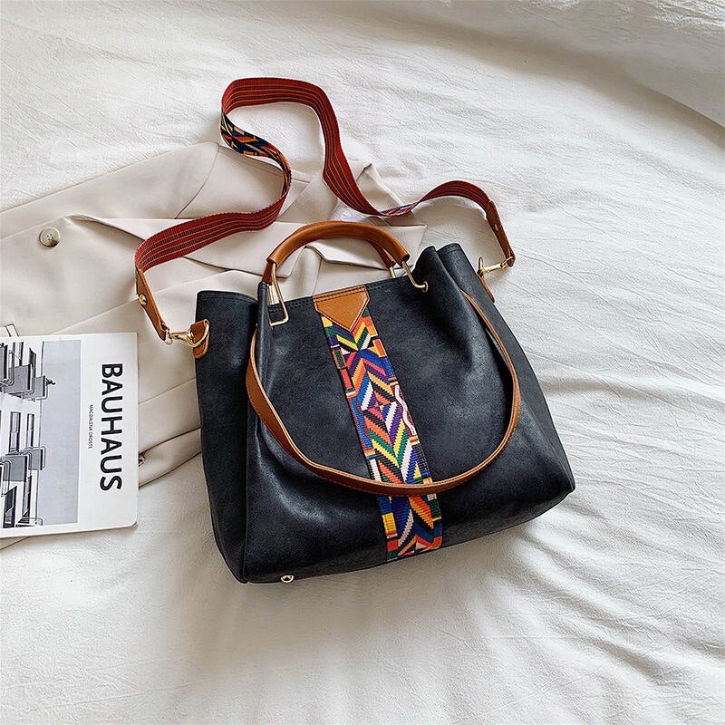 Practical spacious PU leather tote bag for women, ideal for daily use and everyday carry essentials.