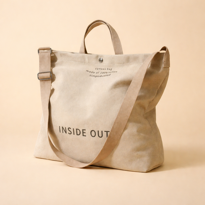 Spacious women's minimalist canvas tote bag in khaki, perfect for everyday use & essentials. Large capacity shoulder bag.