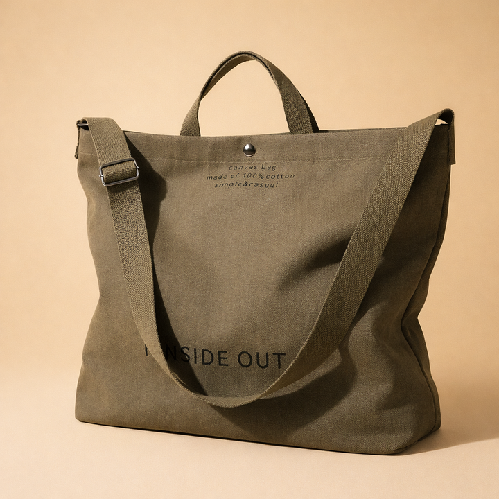 Modern black canvas tote bag for women, minimalist design. Versatile large capacity handbag, great for casual street style.