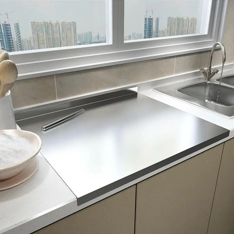 Stainless steel chopping board with non-slip silicone pads, sleek finish, ideal for meat, fish, veggies slicing.