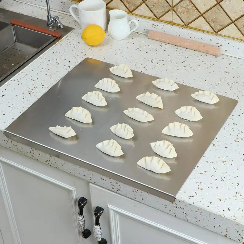 Stainless steel chopping board with non-slip silicone pads, sleek finish, ideal for meat, fish, veggies slicing.