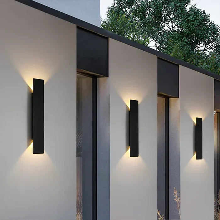 StormGlow weather-resistant outdoor wall lamp, modern up-down exterior light for durable patio and garden illumination.