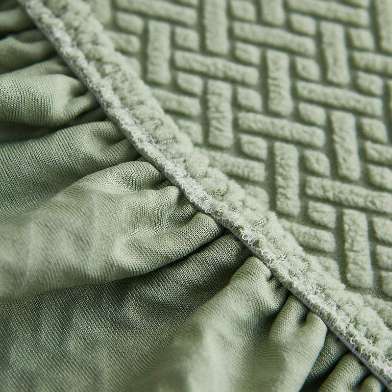 Stretchable sectional sofa cover in vibrant tangerine, snug fit, durable fabric, ideal for home decor and furniture protectio