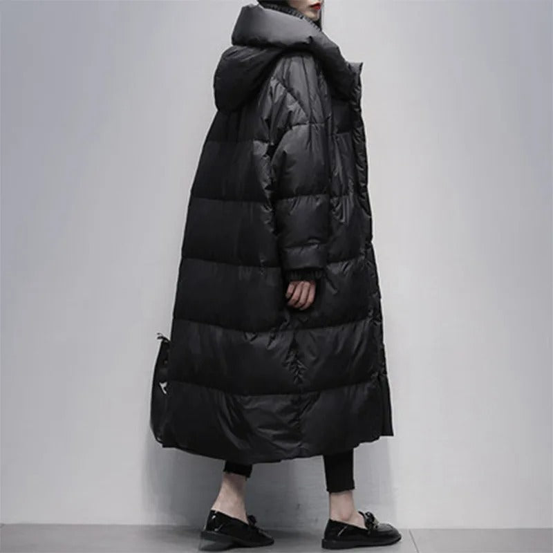 Full-length view of a warm women's long padded winter coat, ideal for cold weather outerwear.