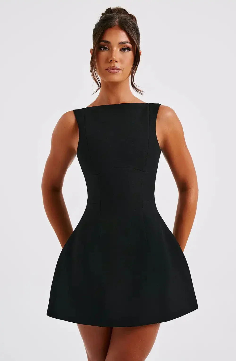 "Stylish black & white women's A-Line boat neck mini dress with elegant sleeveless design, perfect for any occasion."