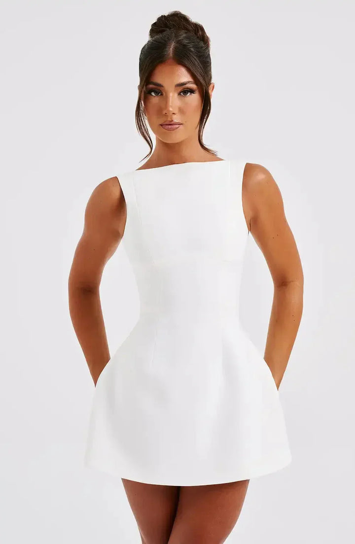 "Stylish black & white women's A-Line boat neck mini dress with elegant sleeveless design, perfect for any occasion."