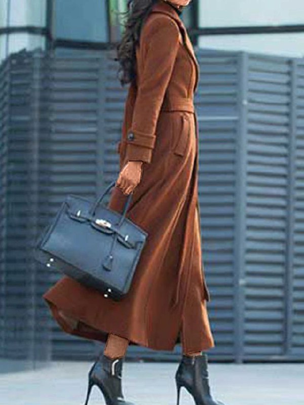 Women's Elora long winter outerwear coat with a stylish shawl collar, prominent button detail, and a cinching waist belt.
