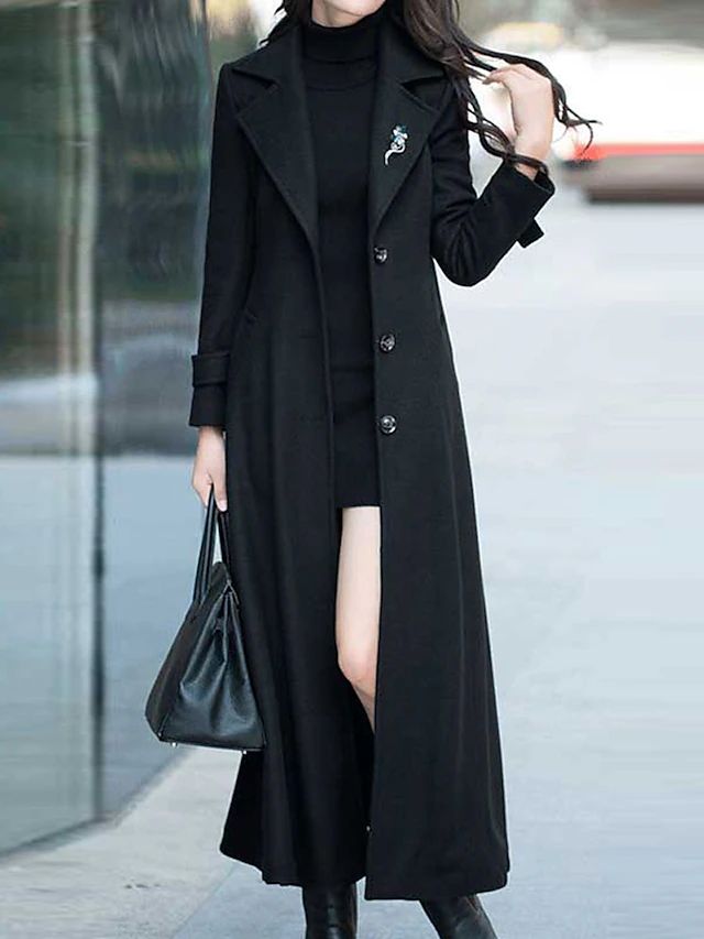 Comfortable Elora women's long winter coat with a stylish shawl collar, button accents, and smart waist belt for warmth.