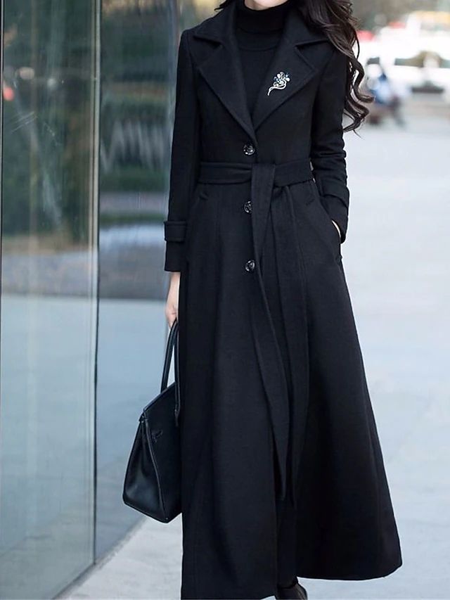 Elegant Elora women's long coat, versatile outerwear with a sophisticated shawl collar, button closure, and waist belt.