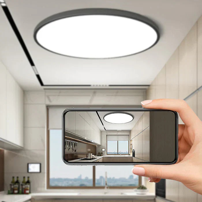 Energy-efficient round LED ceiling light, stylish contemporary design for modern homes.