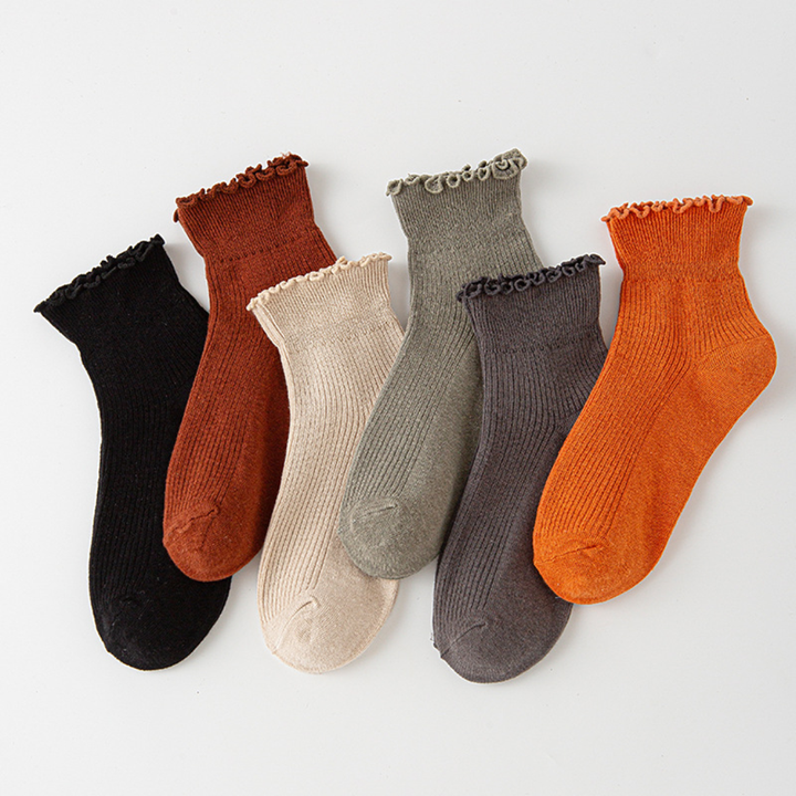 Playful women's casual ruffle ankle socks in a soft fabric, ideal for everyday footwear and style.