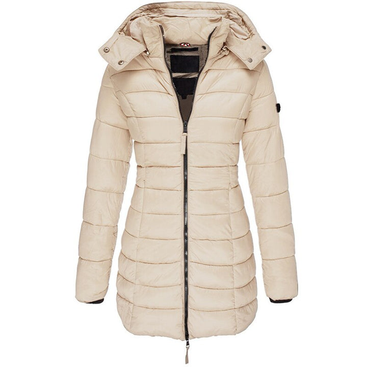 Comfy hooded winter coat for women. This stylish puffer jacket offers superior warmth and protection from cold weather.